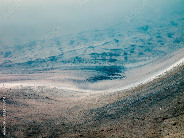 Fototapeta Clos-up of a bank of a mountain stream as artistic, abstract background