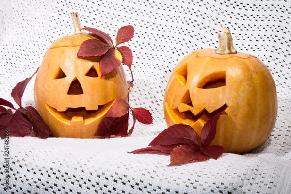 Obraz two amusing pumpkins in a crimson autumn leaf