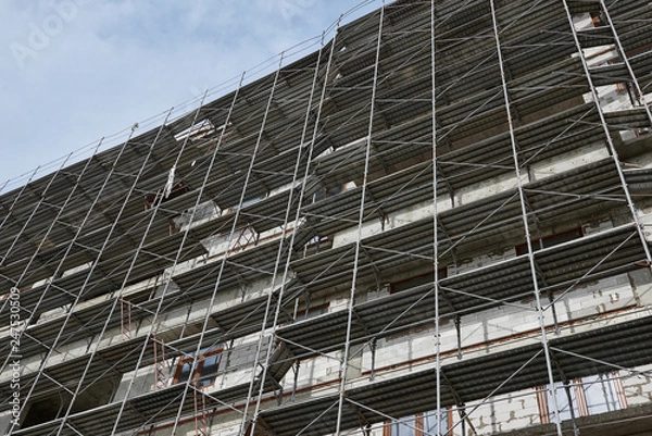 Fototapeta new building under construction, scaffolding and concrete