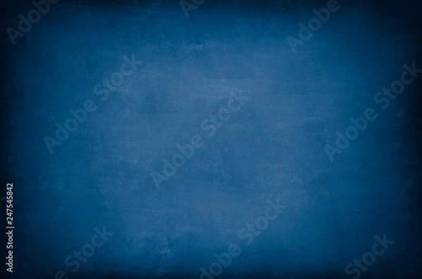 Fototapeta Dark Blue Blackboard. Messy scratchy chalkboard texture as background.