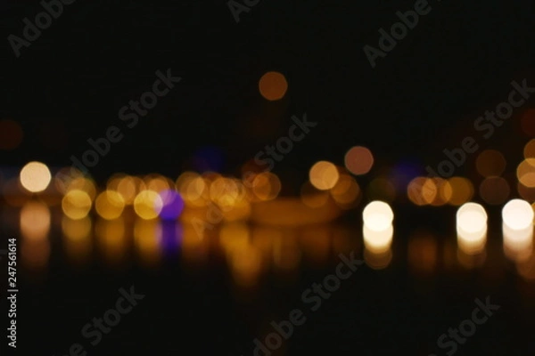 Fototapeta blurry light of building on river background and texture