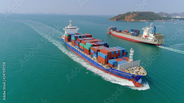Obraz Aerial view container ship going to sea port for unload container. Logistic, import export, shipping or transportation.