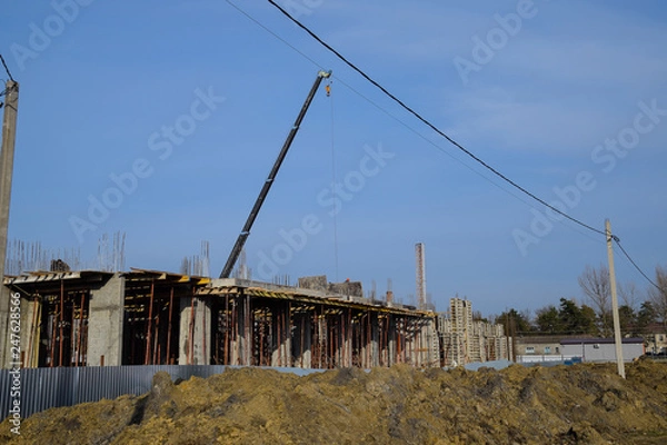 Fototapeta Construction of a residential building, reinforced concrete structures