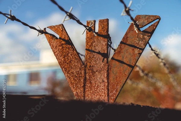 Obraz rusty barbed wire fence