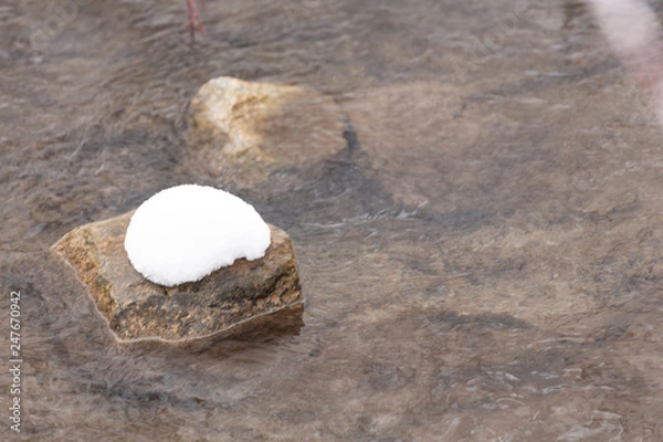 Obraz snow covered rock in a river