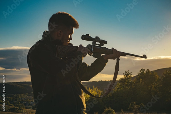 Fototapeta Hunter with shotgun gun on hunt. Most realistic hunting game ever created. Hunting gun.