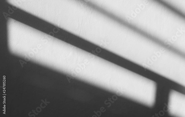 Fototapeta Abstract background of a white wall with shadows from the window. - monochrome