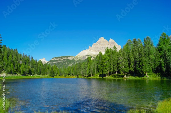 Obraz Mountain lake landscape with moutains and forest on the background