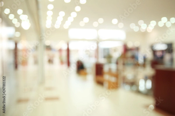 Fototapeta Blurred view of modern shopping mall interior