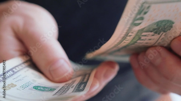 Obraz Businessman hands counting many american 20 dollars banknotes 4K close up slow mo