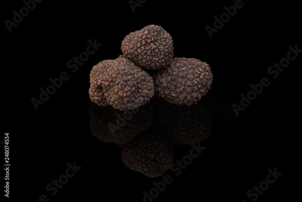 Obraz Truffles isolated on the black background