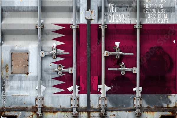 Fototapeta Close-up of a container with the national flag of Qatar. The concept of export-import Qatar and the national delivery of goods.