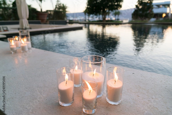 Fototapeta candles are on the side of the pool