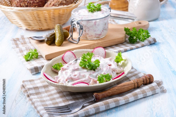 Fototapeta delicious homemade meat salad with mayonnaise and cucumber