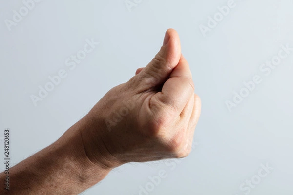 Fototapeta Man's Hand Snapping His Finger