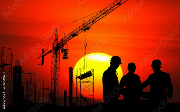 Fototapeta Engineer on site, they are working at building construction area.