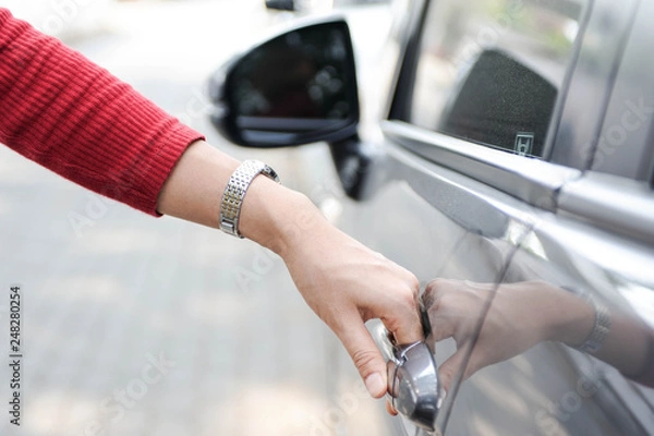 Fototapeta Using hand open the car door,Using hand Close the car door