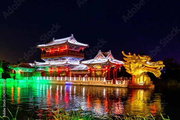 Fototapeta Qingming riverside in Kaifeng, known as “Shui Xi”, is beautifully lighted a night. Kaifeng was the capital of the Song Dynasty, 1000 to 1100AD