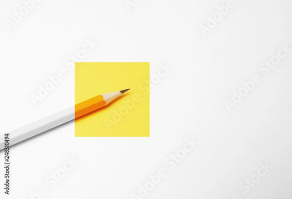 Fototapeta Yellow pencil on white background, minimalism. Creativity, idea, solution, creativity concept.
