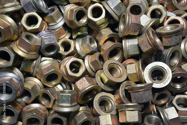 Fototapeta Top view of big pile of screw nuts as background