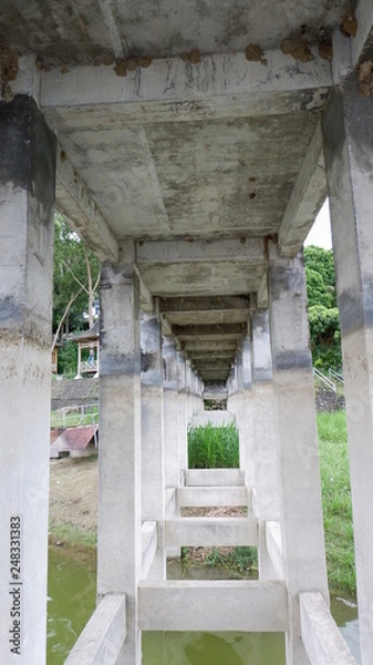Fototapeta cement beam support pillar concrete bridge construction on the dock