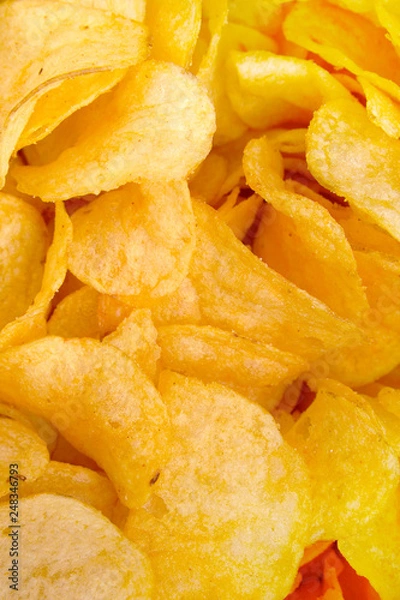 Fototapeta crispy potato chips snack texture background top view