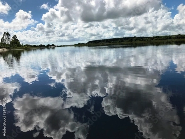 Fototapeta clouds reflected in water