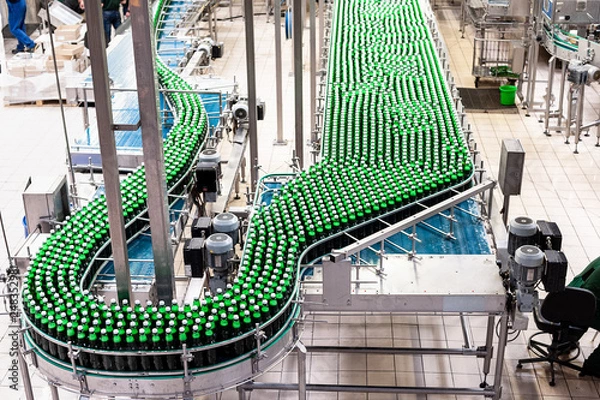 Fototapeta Beer bottles on the conveyor belt