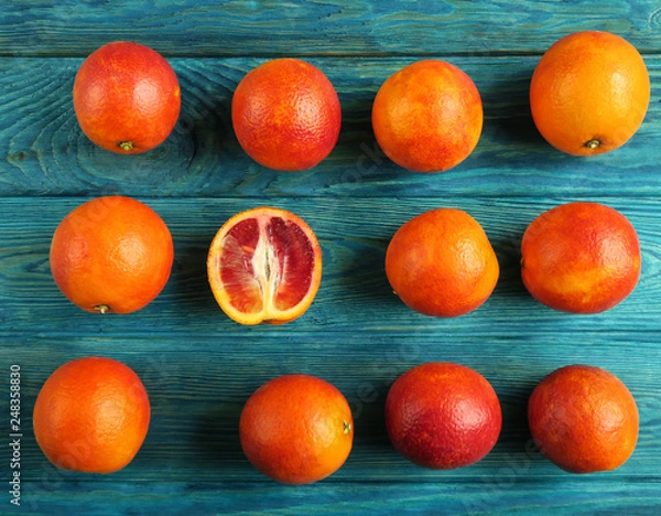 Obraz Blood oranges on a blue wooden table