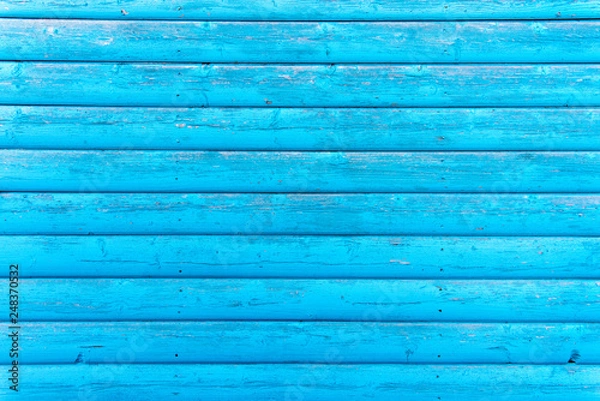 Fototapeta Section of turquoise wood panelling from a seaside beach hut. Perfect as a background for Summer Holiday or seaside themes.