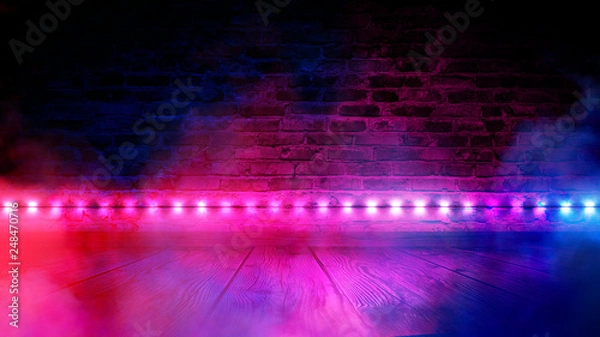 Fototapeta Illumination of an empty brick wall, neon light, smoke. The night scene of an empty room is decorated with abstract light. Night smoke.