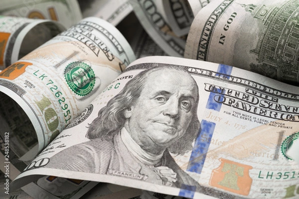 Fototapeta dollars lie chaotically - Image.