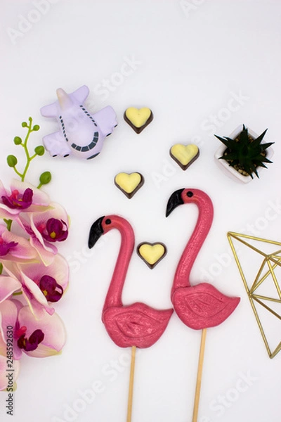 Fototapeta Composition from lollipops, chocolate hearts, pyramid, flower pot, and other decoration