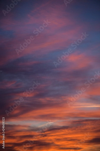 Fototapeta  Sunset sky with clouds. Golden sunlight  for your idea of web header. Cloudy landscape for background in serenity colors - blue, violet, yellow and pink tone.