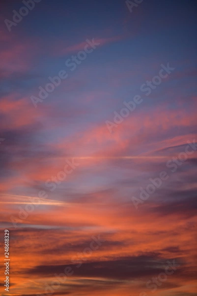 Fototapeta  Sunset sky with clouds. Golden sunlight  for your idea of web header. Cloudy landscape for background in serenity colors - blue, violet, yellow and pink tone.