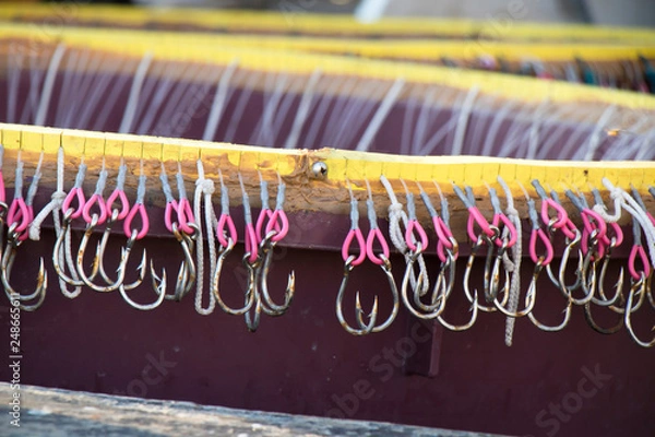 Fototapeta Long line fishing containers with hooks inside a boat