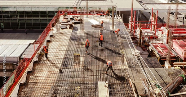 Fototapeta High angle workers in construction site