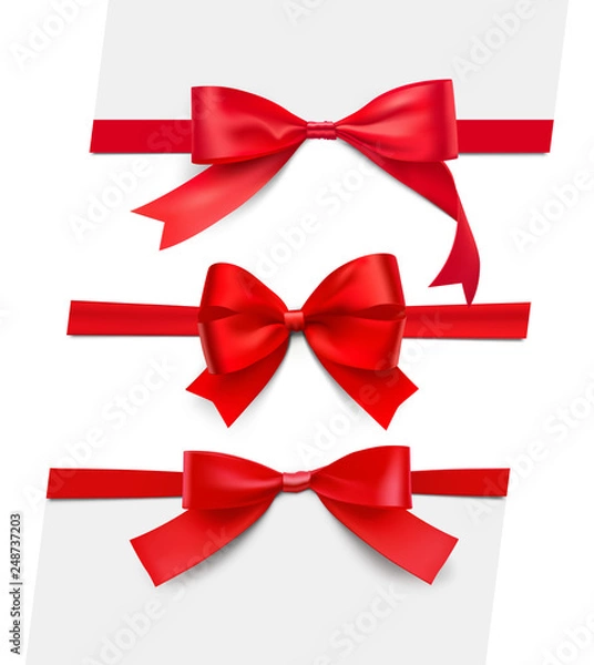 Fototapeta Set of realistic satin red bows. Vector illustration isolated on white background. Can be use for decoration gifts, greetings, holidays, etc. EPS10.
