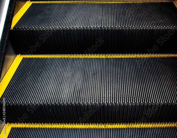Fototapeta Escalator or elevator.