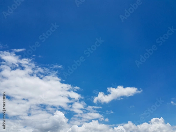 Obraz Soft white tiny clouds and blue sky background on sunny day for abstract background or insert text copy space.