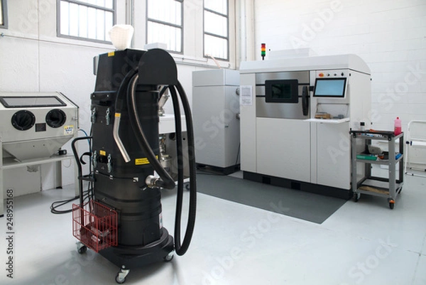 Fototapeta Metal 3D printer (DMLS) - Direct metal laser sintering (DMLS) is an additive manufacturing technique that uses a laser fired into a bed of powdered metal.