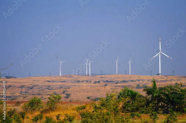 Fototapeta multiple windmill turbines in field 