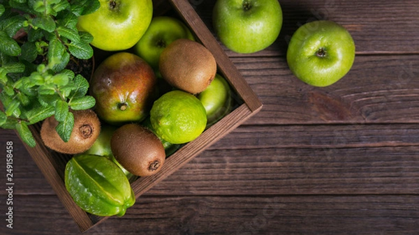 Obraz Set of green fruits for healthy diet and detox: apple, lime, kiwi, mango, carambola and mint.