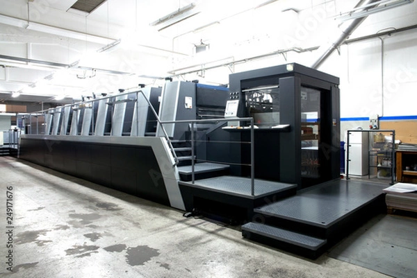 Fototapeta Press printing - Offset machine. Printing technique where the inked image is transferred from a plate to a rubber blanket, then to the printing surface.