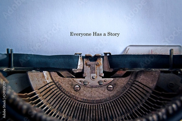 Fototapeta In the old typewriter inserted a white sheet of paper with the inscription: Everyone Has a Story