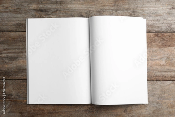 Fototapeta Mockup of open brochure on wooden background, top view