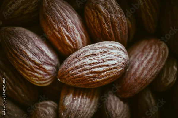 Obraz Raw almond nuts macro view background.