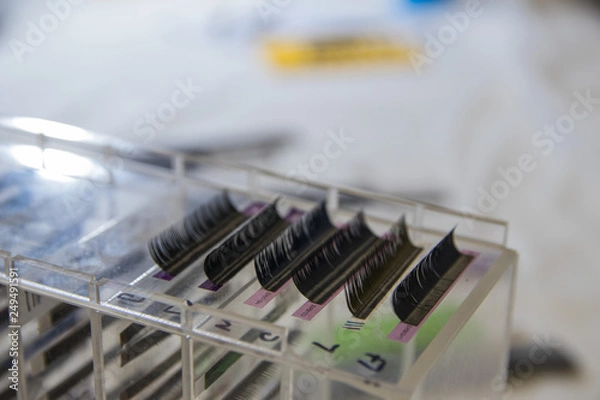 Fototapeta bunches of artificial eyelashes for Eyelash extensions. Selected focus