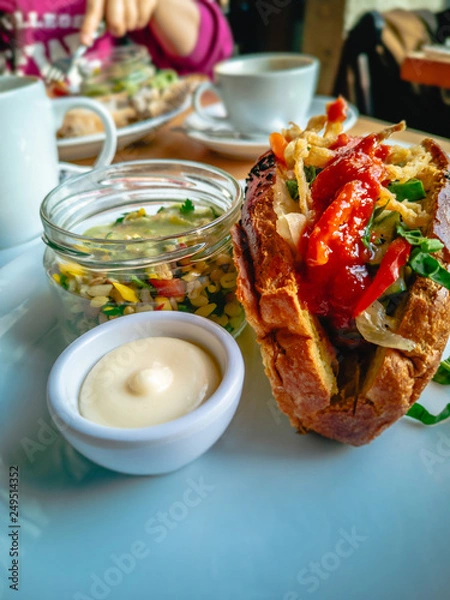 Fototapeta Breakfast corn bread sandwich  with salad and sauce