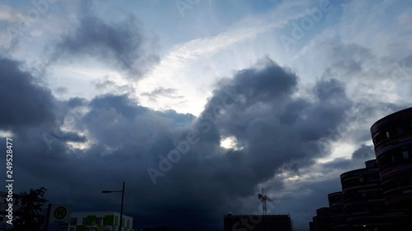 Obraz giant clouds light beatiful sky urban